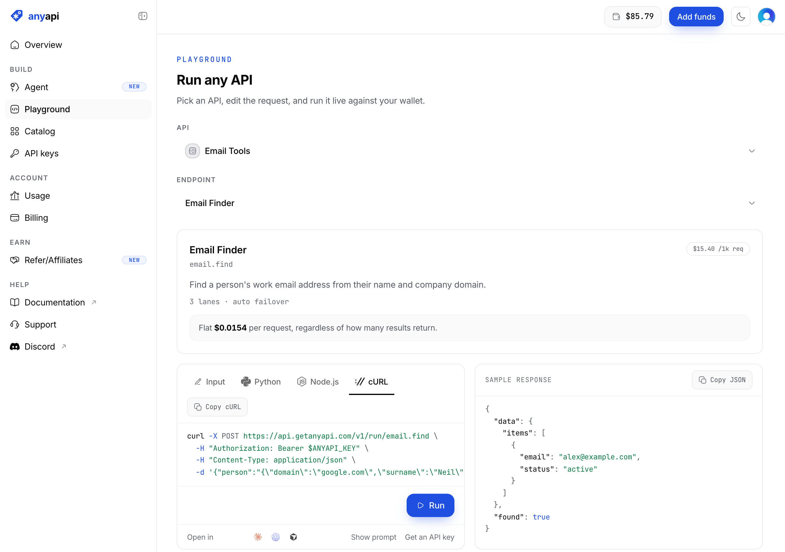 The AnyAPI dashboard playground with the Email Finder endpoint selected, showing the email.find slug, a $15.40 per 1,000 requests badge, a flat $0.0154 per request billing note, three sources with automatic failover, and the generated cURL request